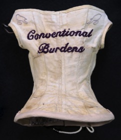 Unique artist book corset Conventional Burdens Corset embroidered title on front of corset