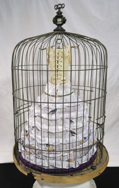 Unique artist book corset series, victorian bird cage, cage with hanging corset, crinoline back view with ties on corset