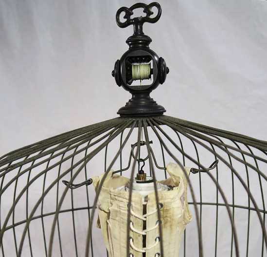 Unique artist book corset series, victorian bird cage, cage with hanging corset, detail of vintage knob turning part