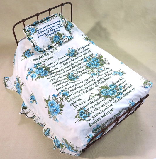 Unique artist book bed, Vintage metal doll bed, embroidered stories text girls in institutions, schools, vintage and recycled textiles